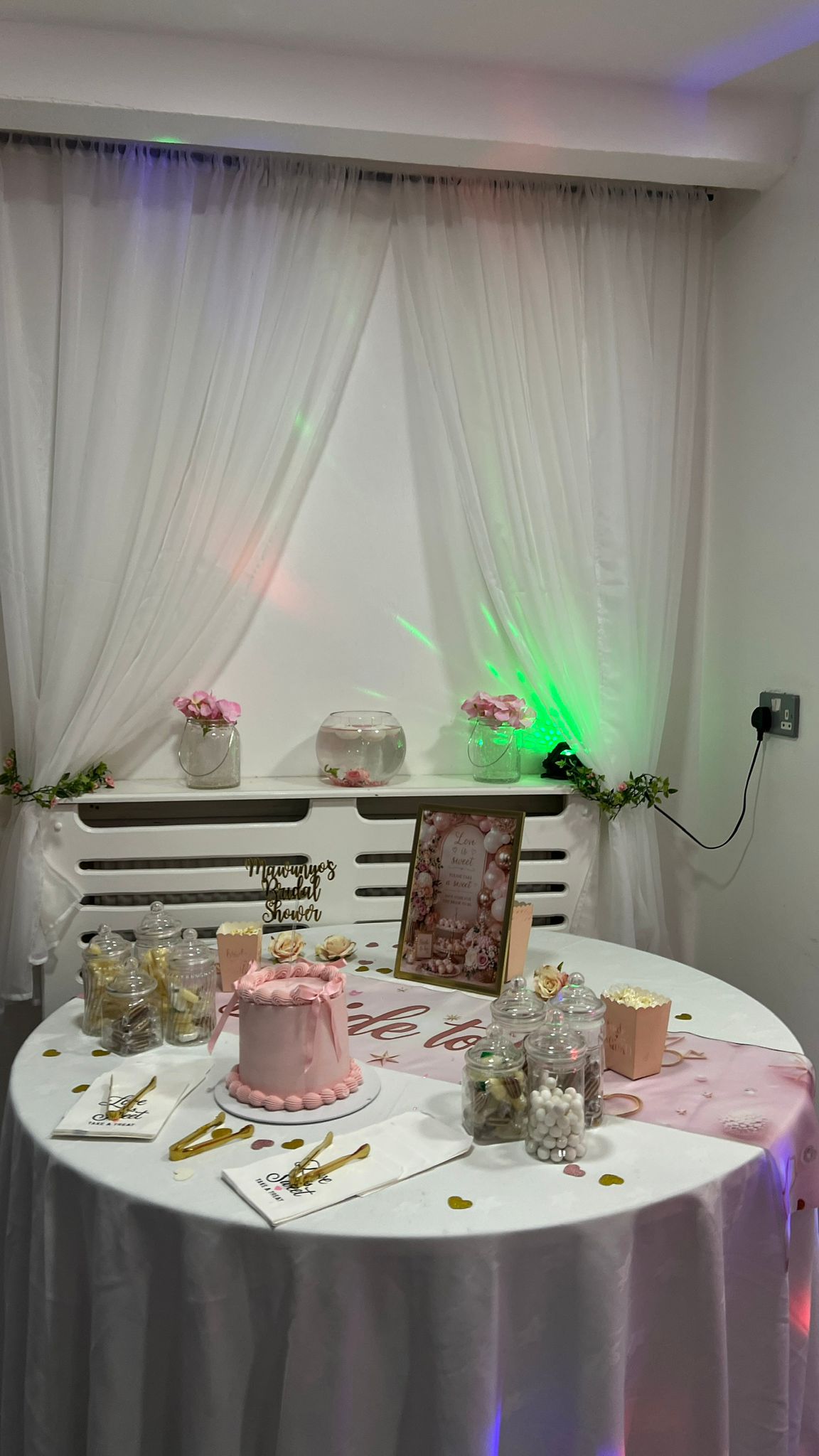 Pink bridal shower cake and sweets display